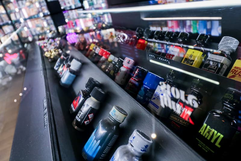 Bottles lined up in a display case